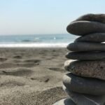 Stack of stones on beach during daytime